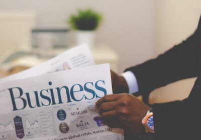 Blog Man reading business newspaper