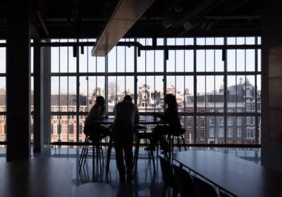 People having a meeting inside a building